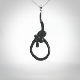 A gorgeous hand carved black jade bowline knot pendant with sterling silver. Hand made in Black Jade with Sterling Silver and provided with sterling silver chain.